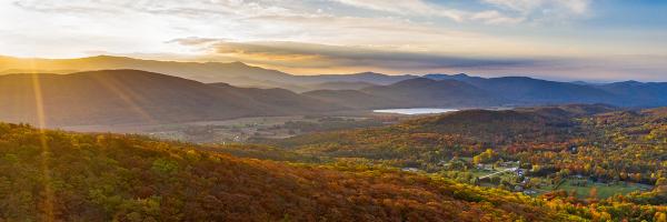 Sunrise, Monkton, Vermont. Photo: Kelly Schulze, University of Vermont Sunrise and landscape of forests, mountains, pond